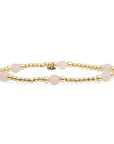 Edelsteen armband met rose quartz in goud kleur