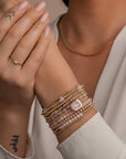 Goudkleurige kralenarmband voor dames met rose quartz edelstenen