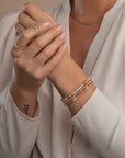 Dames armband in goudkleur met kralen en rose quartz edelstenen